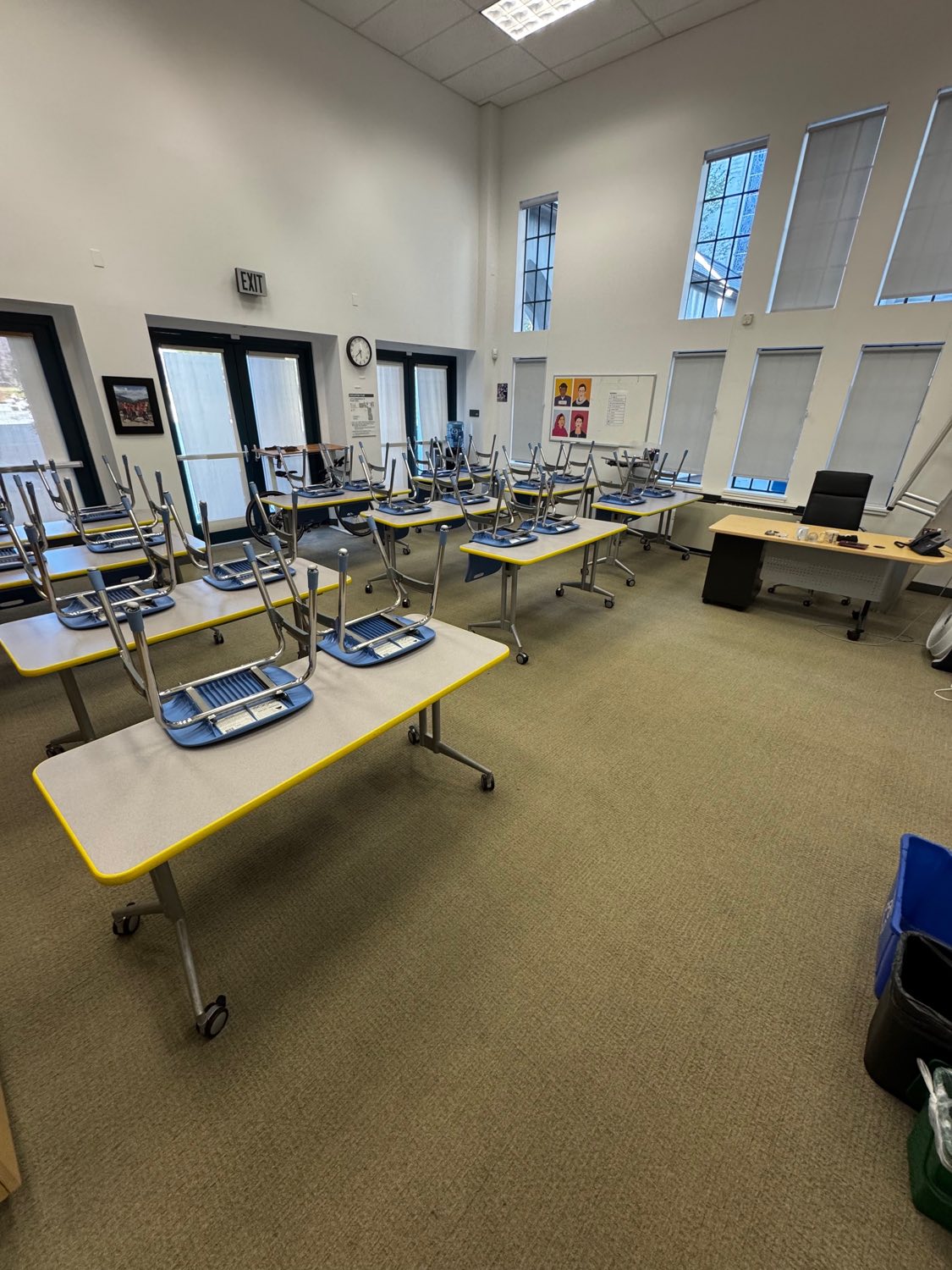 Classroom with chairs up on tables after overnight cleaning