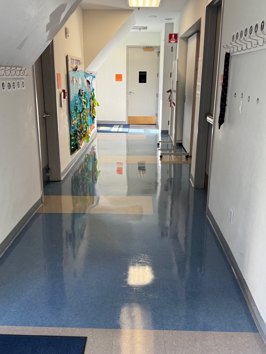School hallway VCT floor burnished to a mirror shine